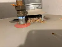 Corrosion at the top of a gas water heater found on an emergency call in Lancaster, PA