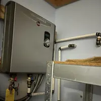 Lancaster Water Heater Pros installing a new electric water heater in a Lancaster, PA home