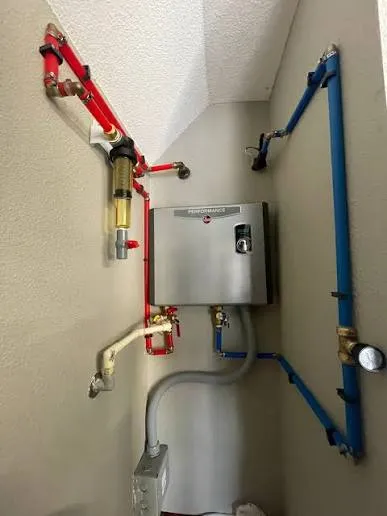 Tankless water heater repair on a wall-mounted unit in Lancaster, PA