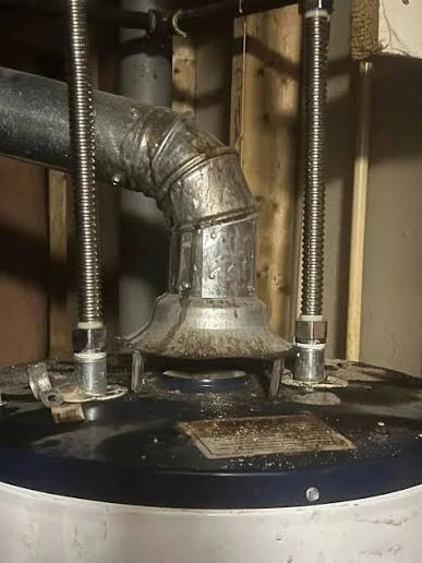 Checking water heater flue draft in an older Ephrata, PA home basement